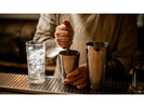 A bartender using a muddler