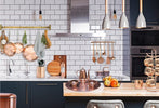 Copper in interior design with copper mugs in the kitchen