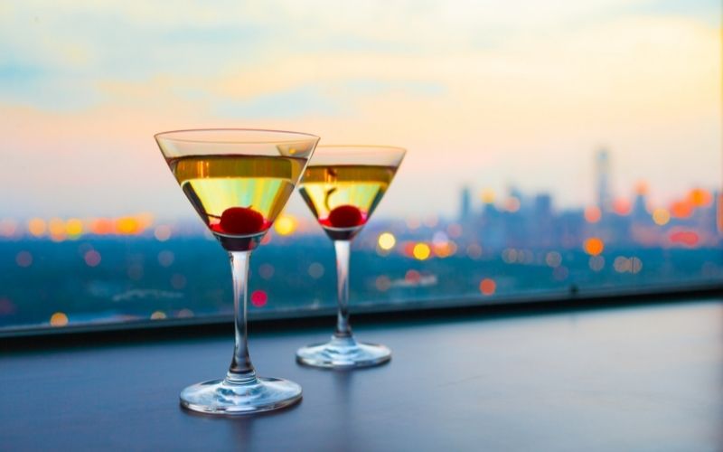2 Glasses of cocktail with maraschino cherry