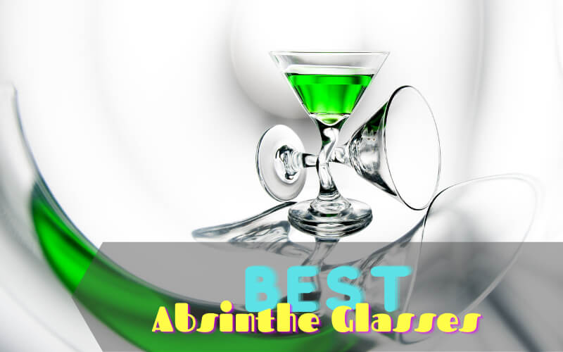 A glass of Absinthe beside an empty martini glass
