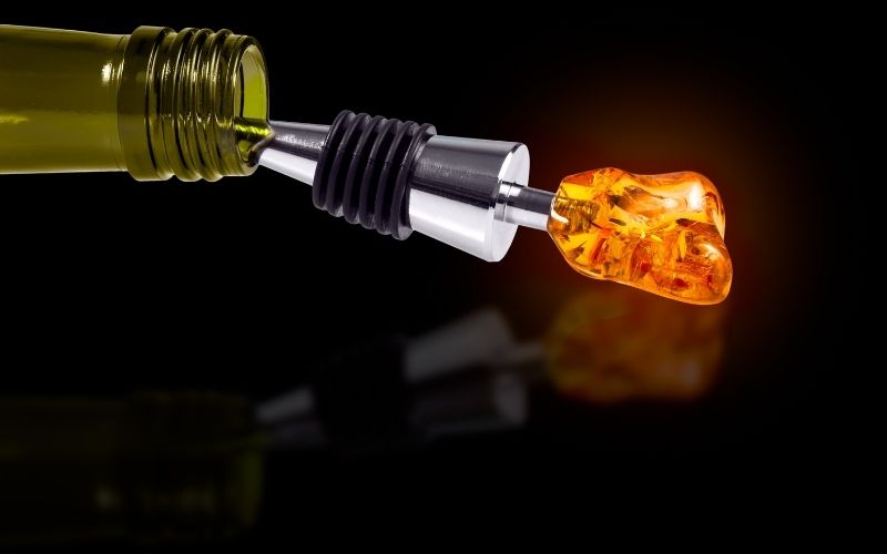 Bottle of Wine with a Stopper from Amber isolated on