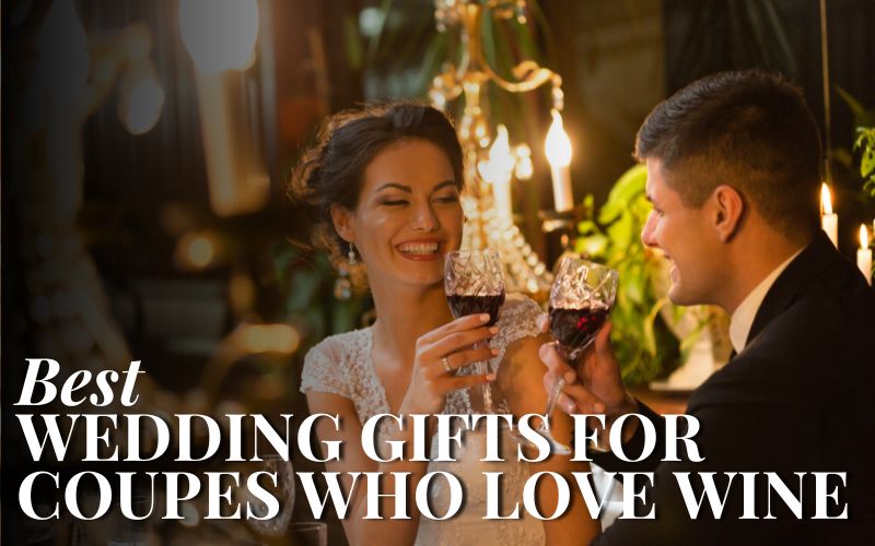 Newly wedded couple drinking red wine