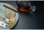a Cuban cigar on a snifter glass of brandy