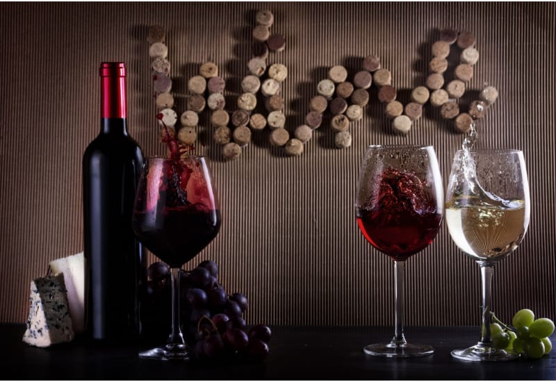 A bottle of wine with wine glasses