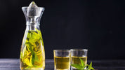 Liquid marijuana in a bottle and shot glasses