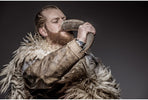 Portrait of a Viking warrior drinking mead from a horn